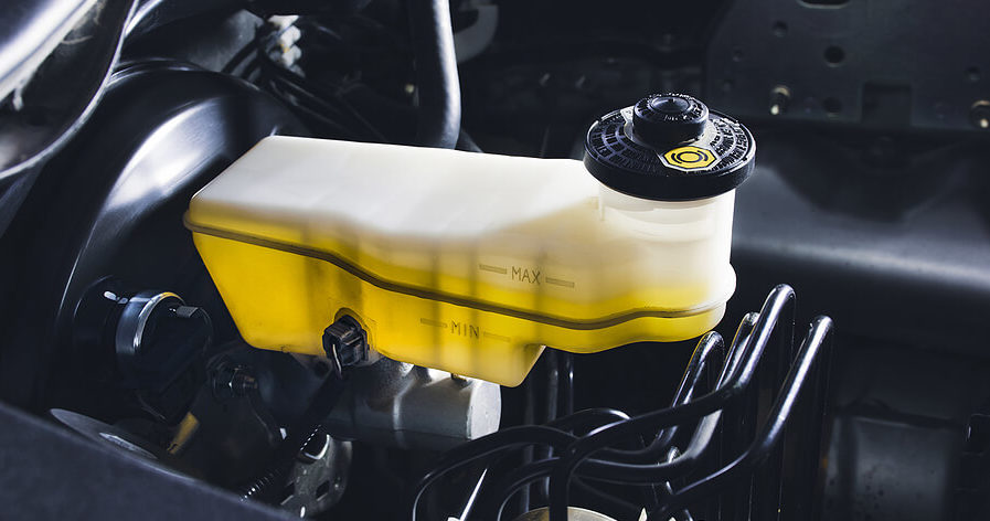 Brake fluid replenished in a car as part of fluid exchange services at ABS Unlimited