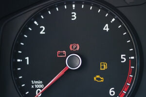Why Can't I Just Ignore the Check Engine Light? | ABS Unlimited in Fairfax, VA. Closeup image of a car dashboard shown check engine light.
